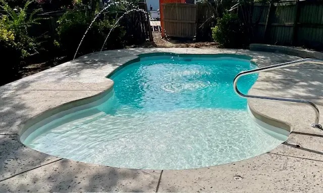 Completed pool with surrounding patio