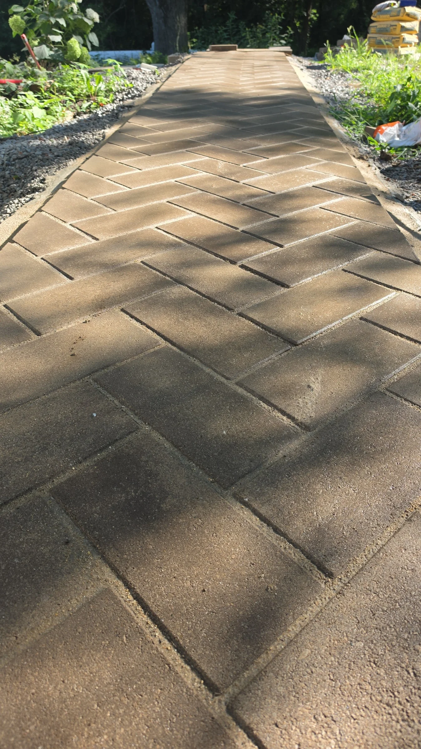 Completed stamped walkway with a herringbone pattern
