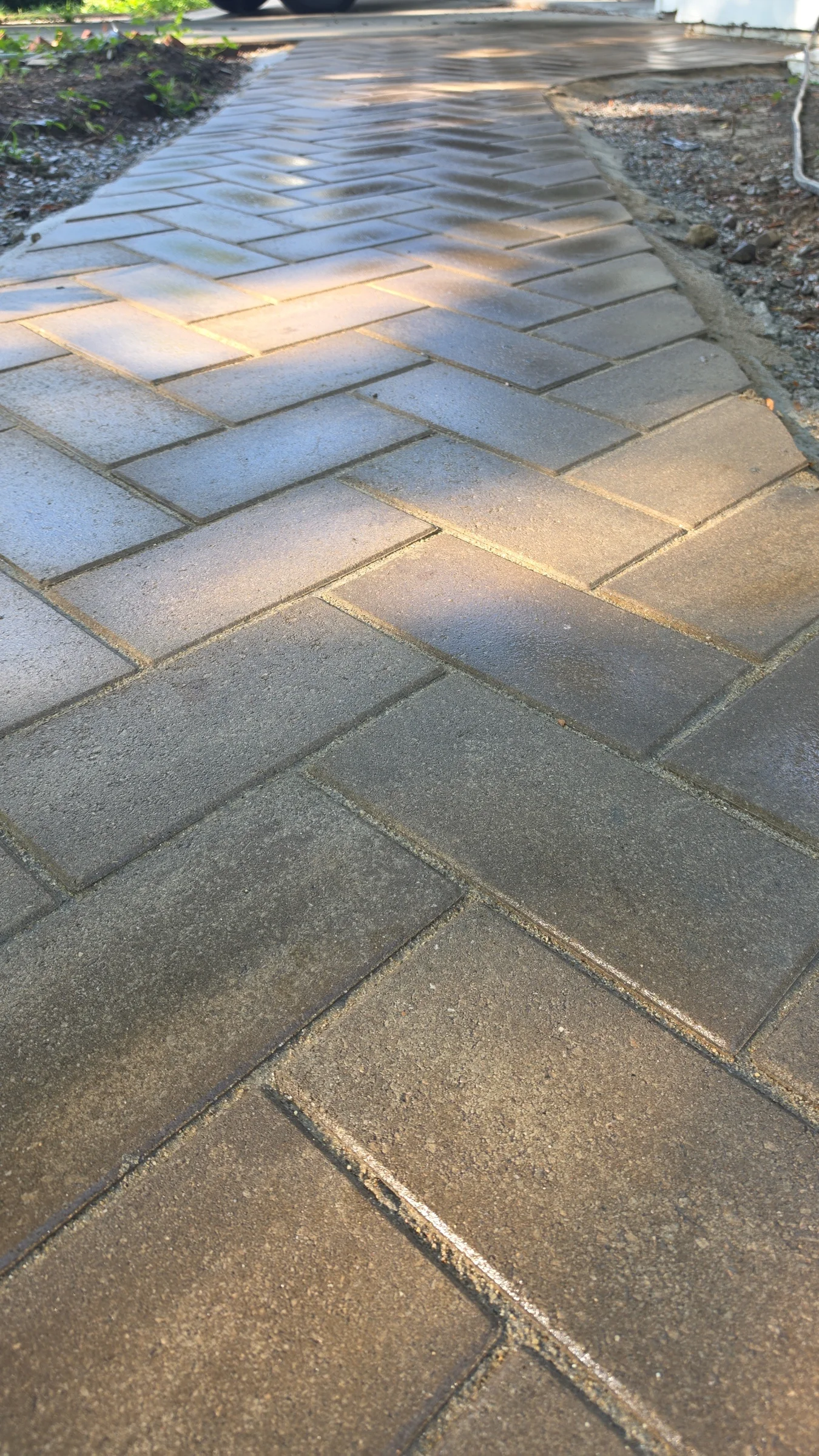 Close view of a finished herringbone-pattern walkway