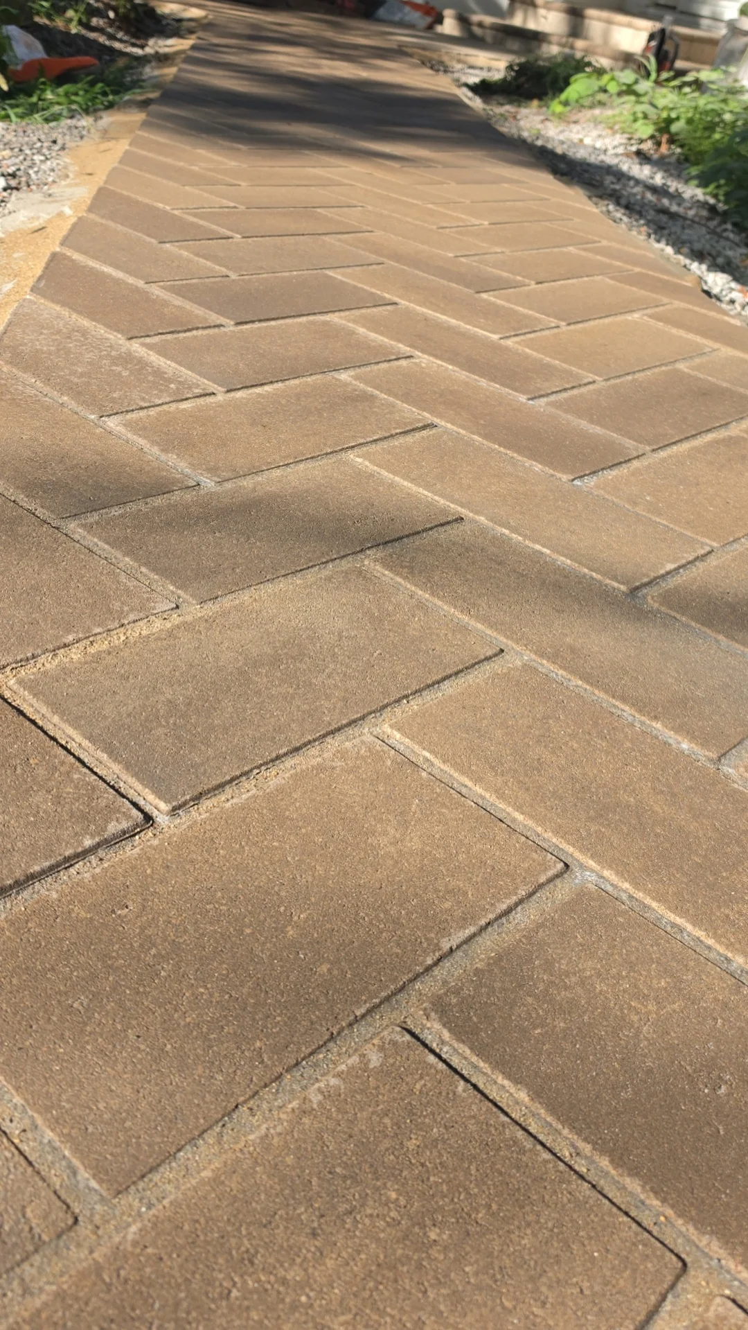 Finished walkway with a warm-toned rectangular concrete pattern