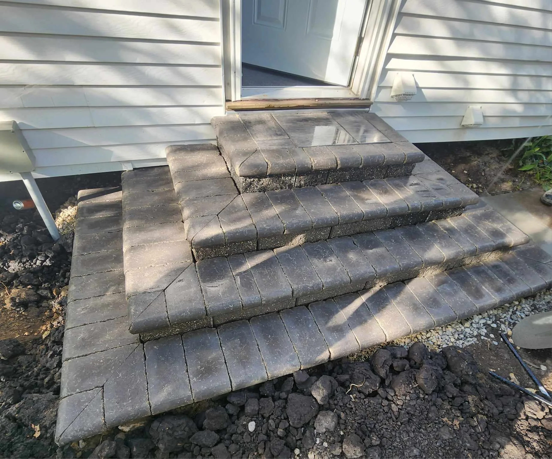Paver entrance steps and landing at a residential home